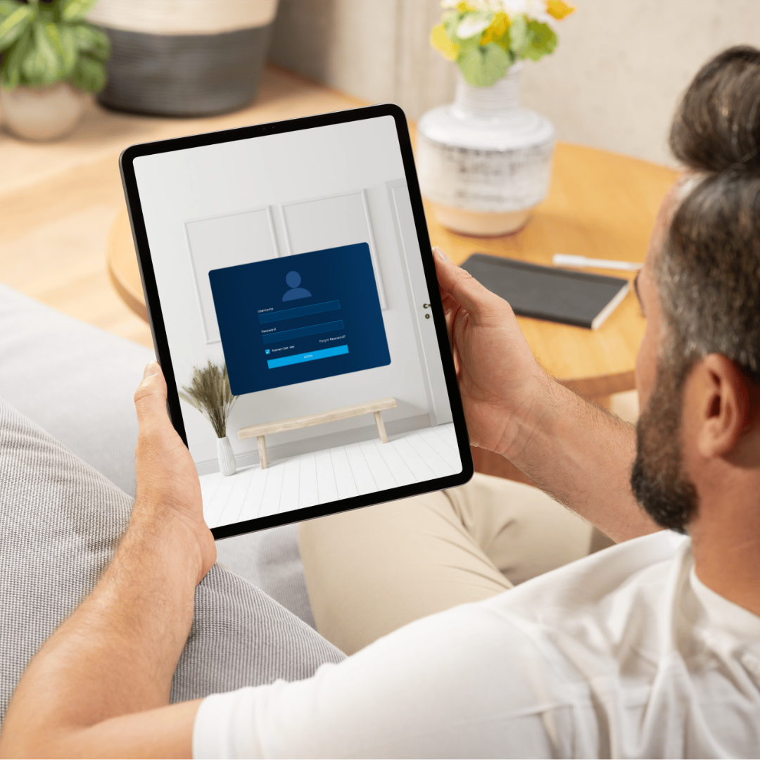 Someone on an iPad showing a login screen